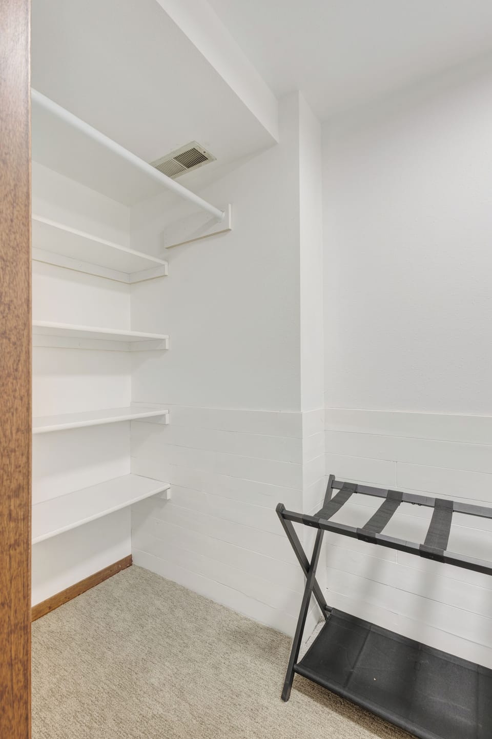 Walk in closet attached to basement bedroom