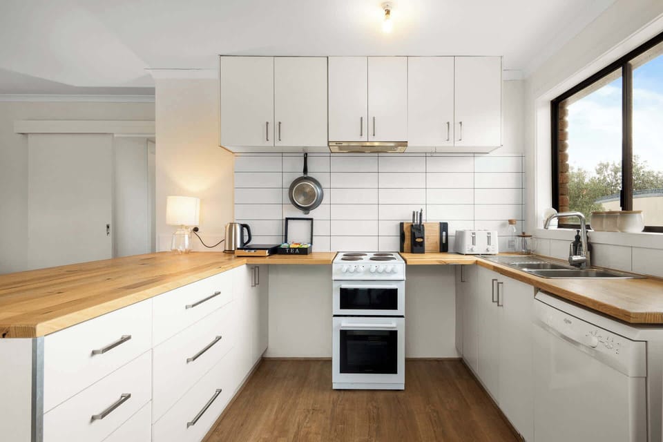 Fully equipped kitchen with stove, oven, fridge, kettle, toaster, microwave, dishwasher, coffee machine and more!