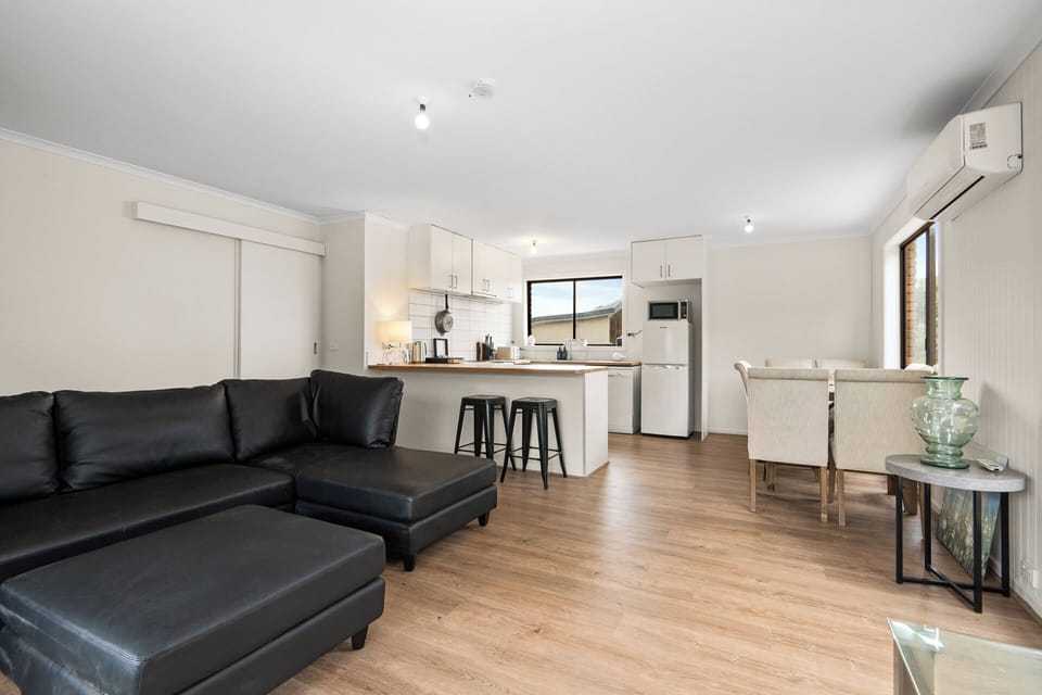 Light-filled living room with TV and ample seating