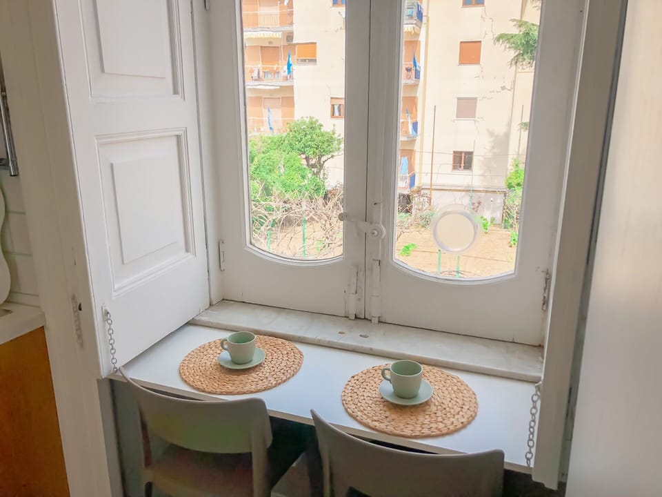 Apartment, City View | Living area | 32-inch flat-screen TV with digital channels