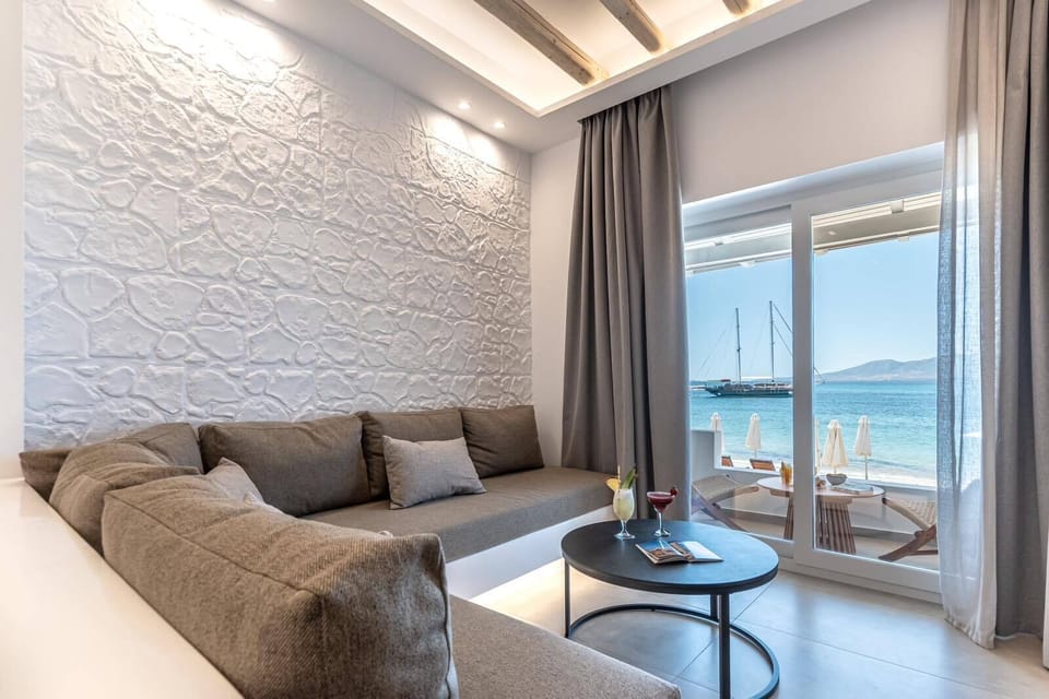 Luxury Suite, Beach View | Living area | 32-inch flat-screen TV with cable channels