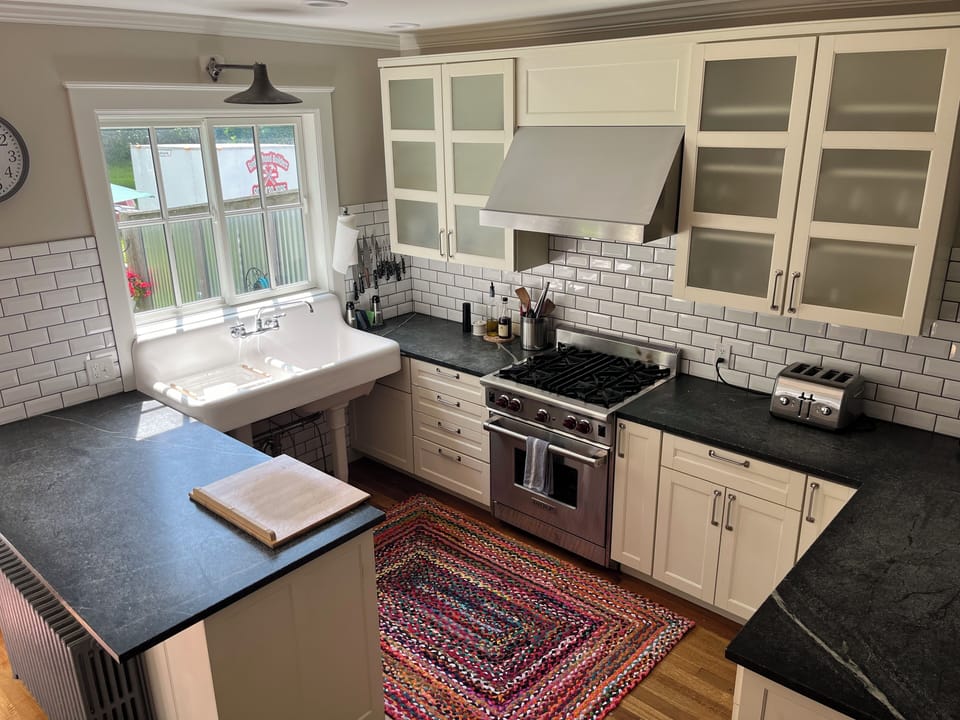 Kitchen with farmhouse sink, Wolf gas range, dishwasher.  No garbage disposal