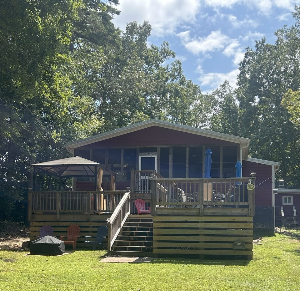 Back deck with fire pit in yard