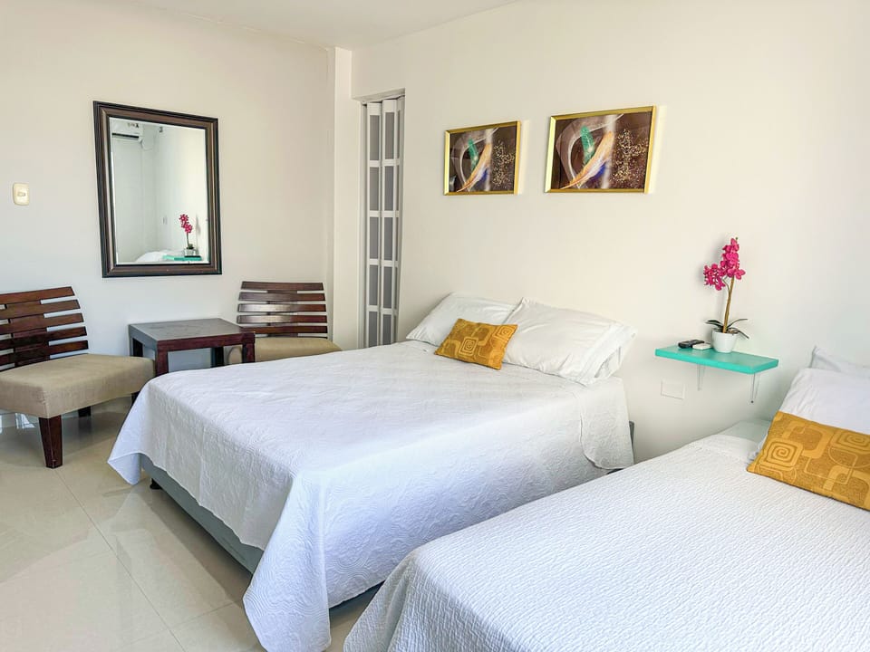 Comfort Triple Room, Housekeeping, Courtyard View | Free WiFi, bed sheets