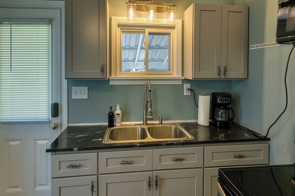 Bright, modern kitchen with all essentials provided.