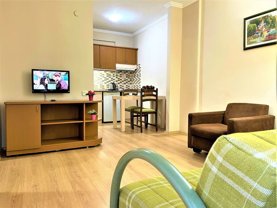 Family Apartment, 1 Bedroom, Kitchenette, Partial Sea View | Premium bedding, minibar, in-room safe, desk