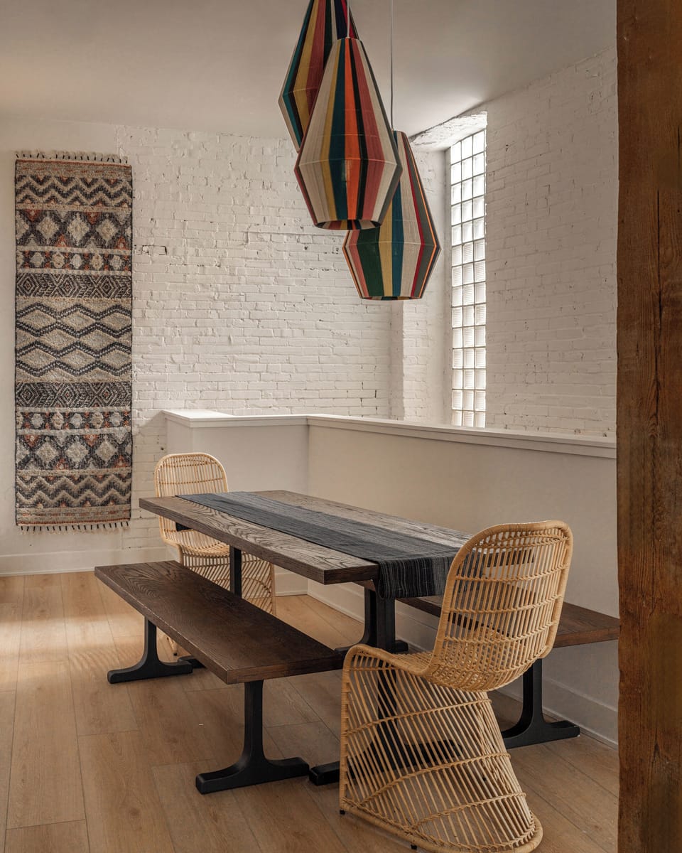 Wood bench and pendant lighting, perfect for a relaxed meal or morning coffee.
