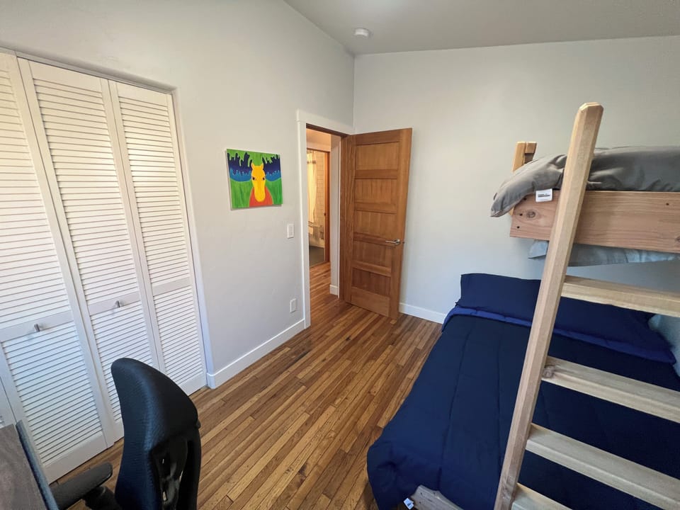 Desk in guest bed w/ bunk beds.