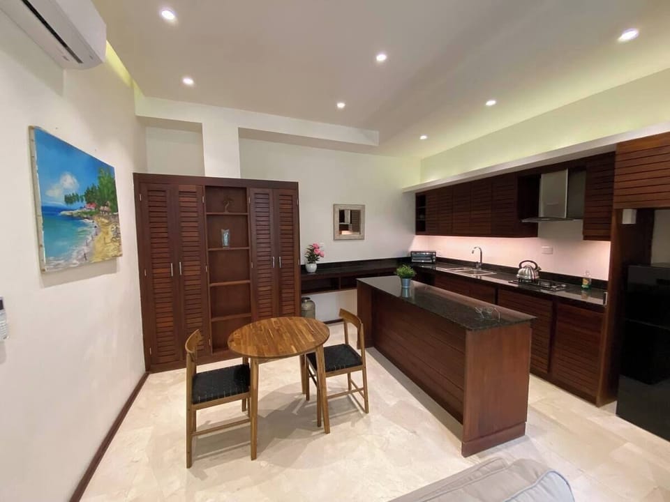 Superior Suite, Patio, Pool View | Living area | Printers