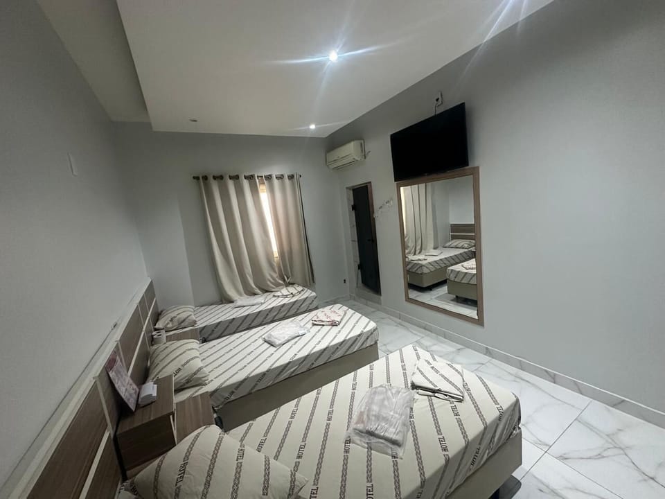 Economy Triple Room | Desk, laptop workspace, free WiFi