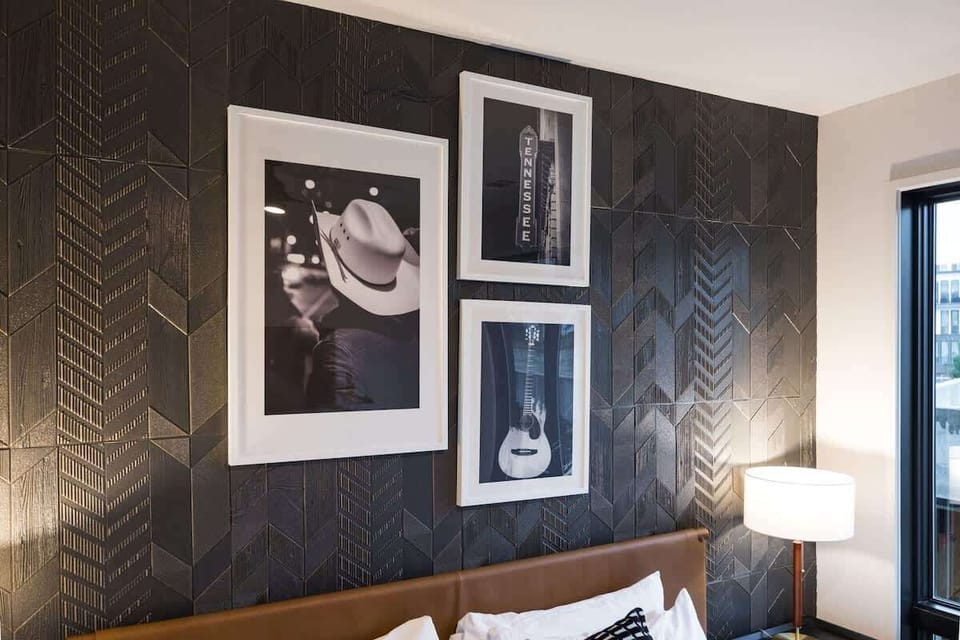 Unit 1: Primary Bedroom with King bed, smart TV, large walk-in closet, and en-suite bathroom.