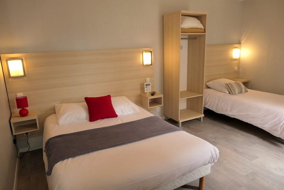 Triple Room | Desk, blackout drapes, iron/ironing board, free WiFi