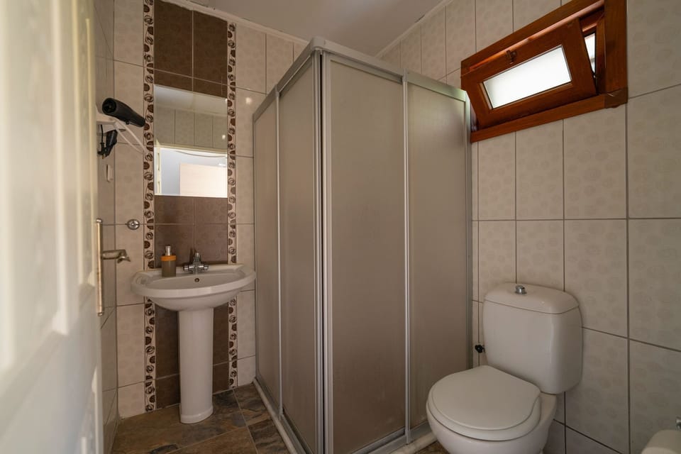 Honeymoon Room, 1 Queen Bed, Sea View | Bathroom | Shower, free toiletries, hair dryer, slippers