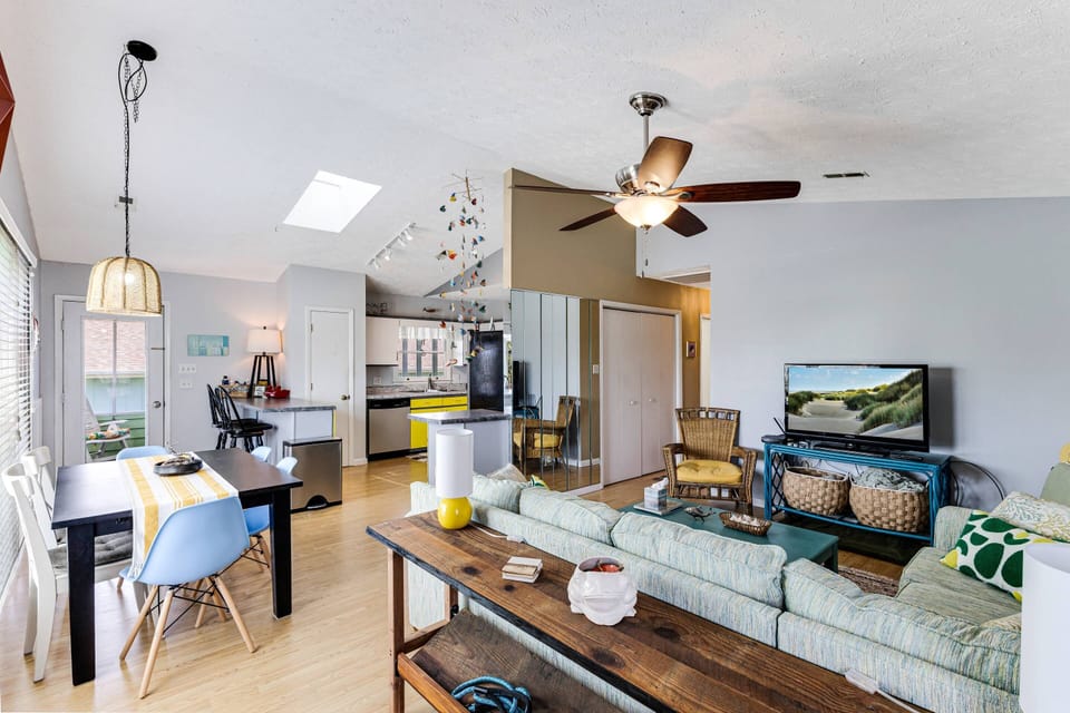 View of Living area with dining table and kitchen in the distance