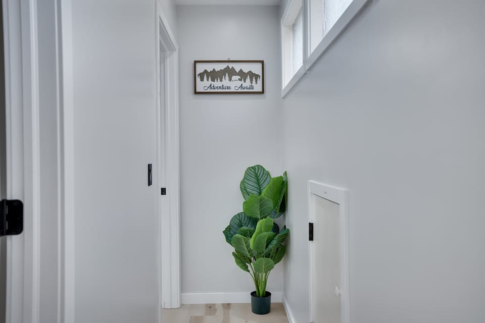The hallway seamlessly connects the cozy spaces of the home, offering a smooth flow between rooms while maintaining a sense of privacy and comfort.