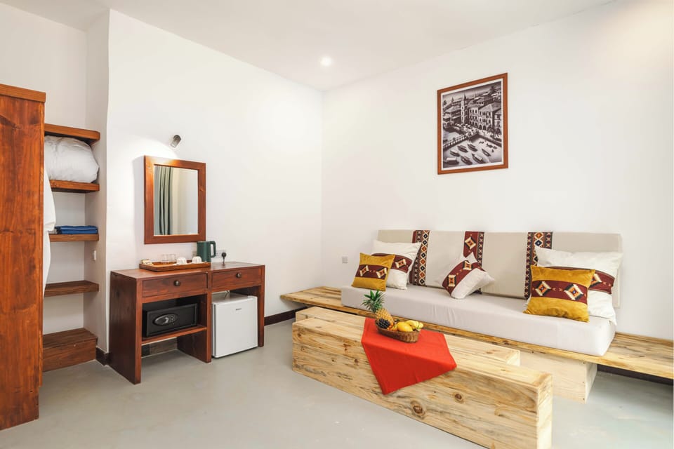 Standard Triple Room, 1 Bedroom, Garden View | Minibar, in-room safe, desk, laptop workspace