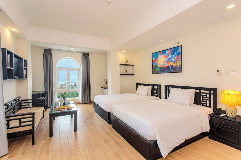 Family Suite, Sea View | In-room safe, desk, laptop workspace, blackout drapes