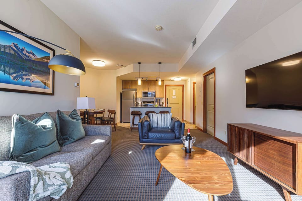 A cozy living space that flows effortlessly into the dining and kitchen area.