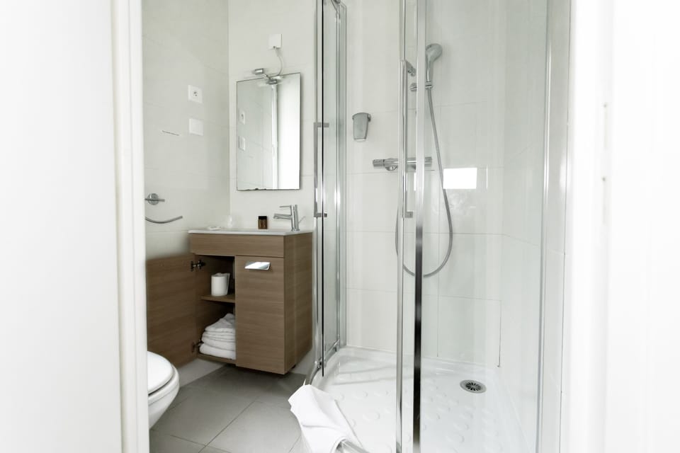 Economy Double Room | Bathroom | Free toiletries, towels