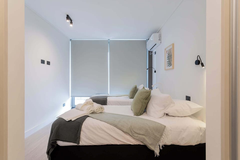 Your cozy corner in Santiago. Whether you're traveling with a companion or prefer your own space, our twin bedroom provides a comfortable and private retreat.