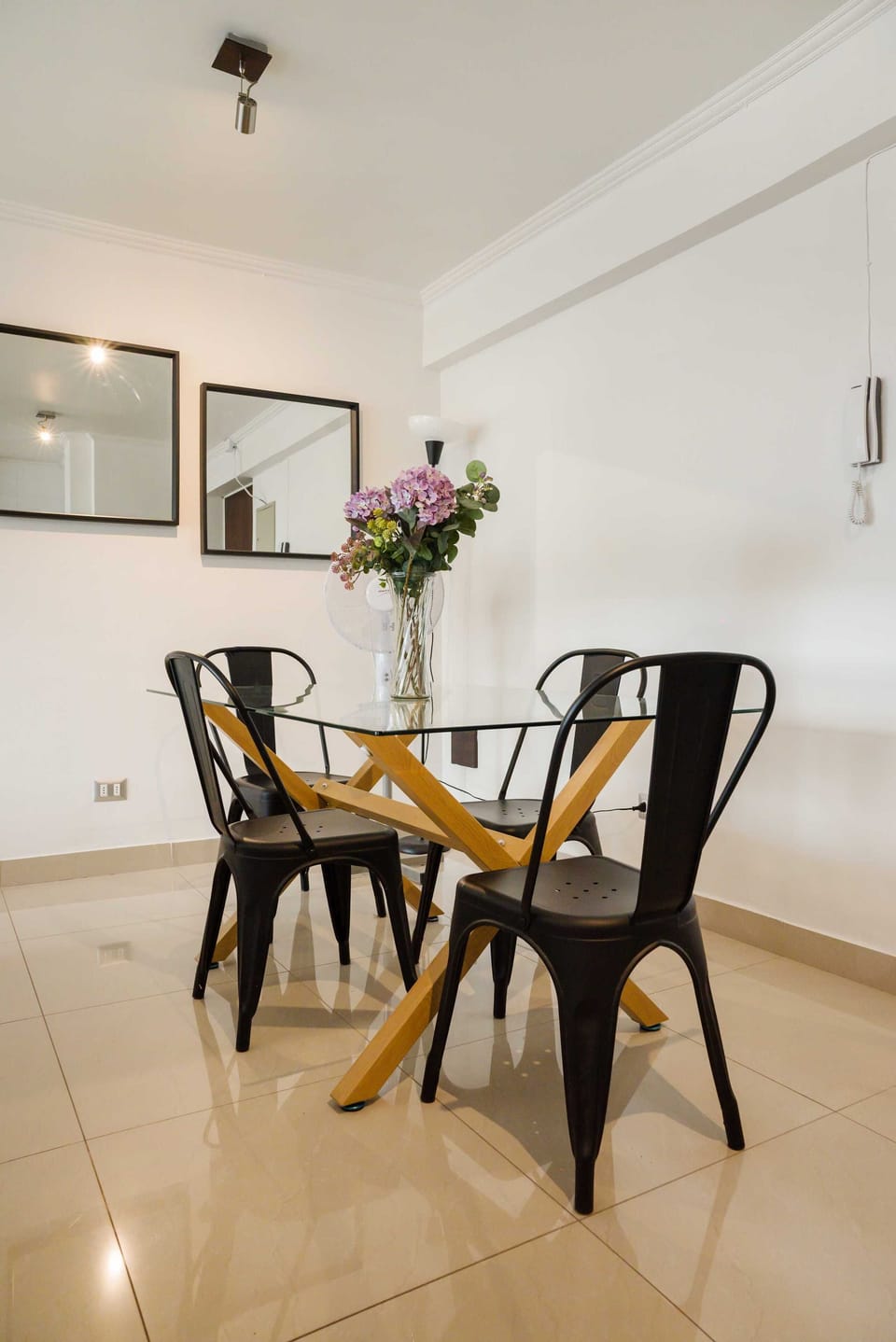 Dine in style in this chic dining area with modern decor and a cozy ambiance, perfect for intimate meals.