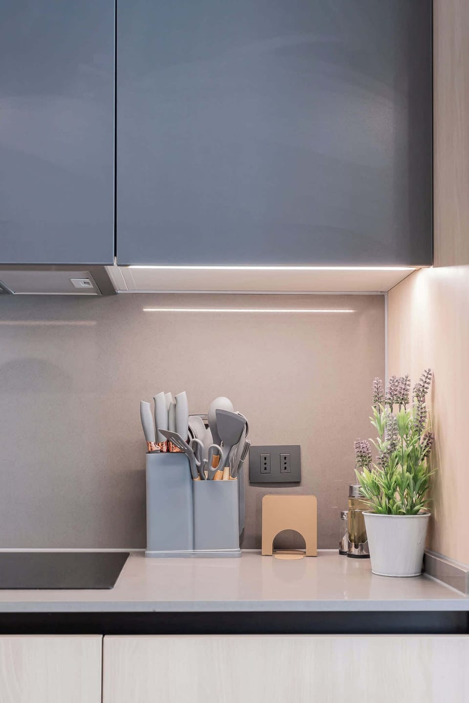Experience a sleek, modern kitchen equipped with stylish utensils and ambient lighting, perfect for culinary adventures during your stay!