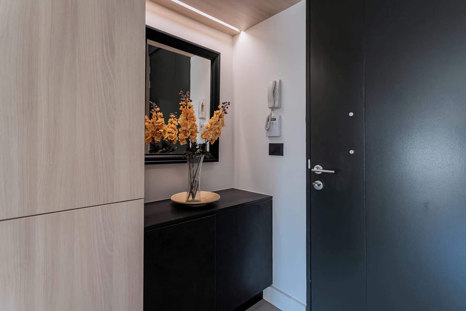 Step into a stylish and welcoming entryway, setting the tone for your stay in this chic studio apartment.