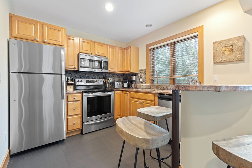 Kitchen - Fully remodeled kitchen is gorgeous with new countertops, backsplash, and stainless steel appliances.  Cupboards contain all needed to cook and dine.
