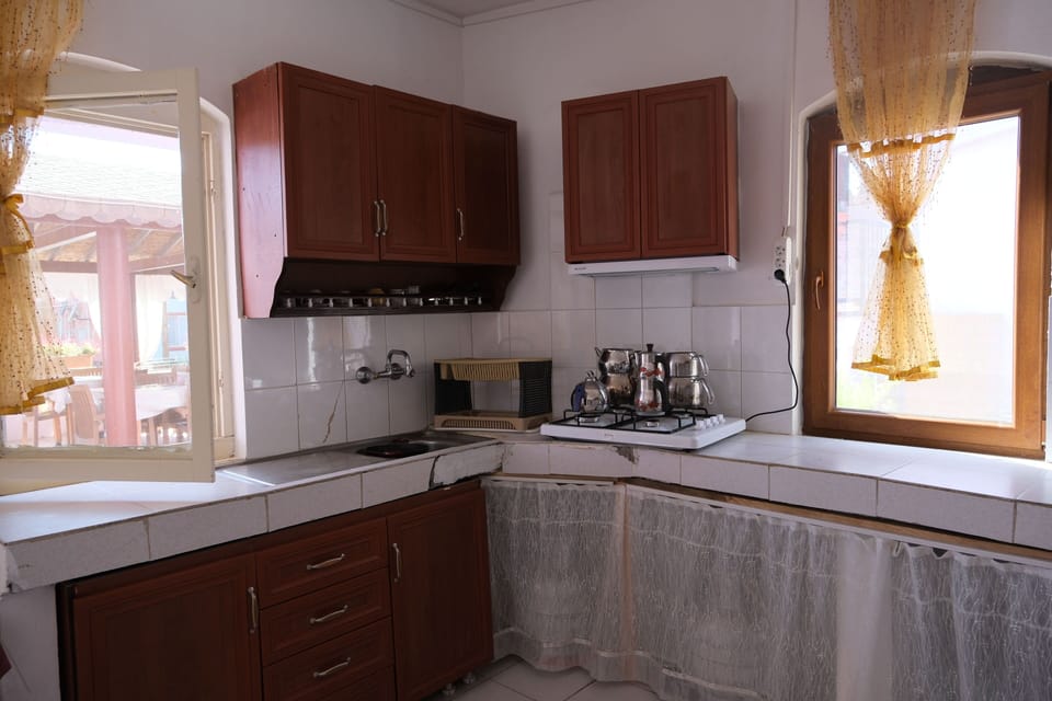 Mini-fridge, stovetop, cookware/dishes/utensils