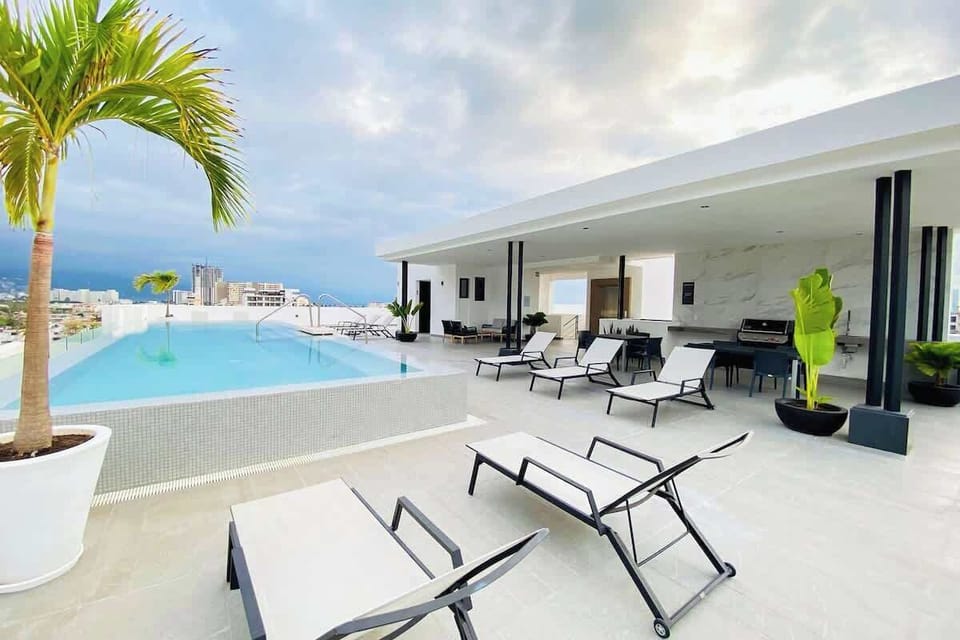 Enjoy the rooftop pool and lounge area at the complex