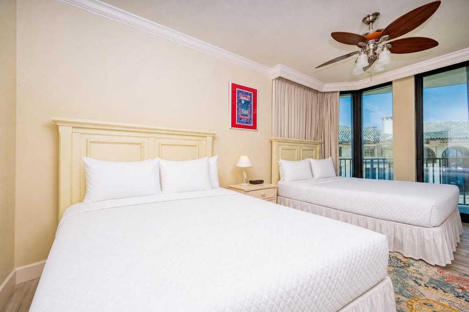 Relax on one of the cozy queen beds in this guest suite and enjoy a peaceful slumber
