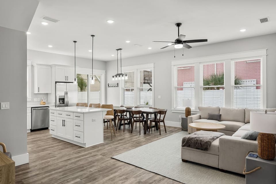 Large kitchen with bar seating and stainless appliances