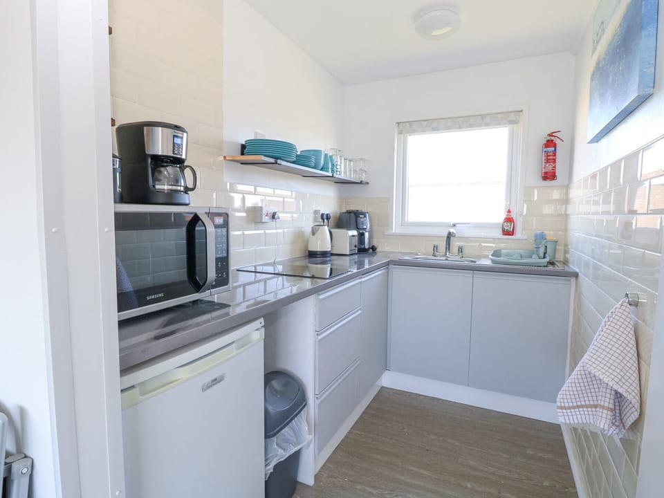 Fridge, microwave, toaster, cookware/dishes/utensils