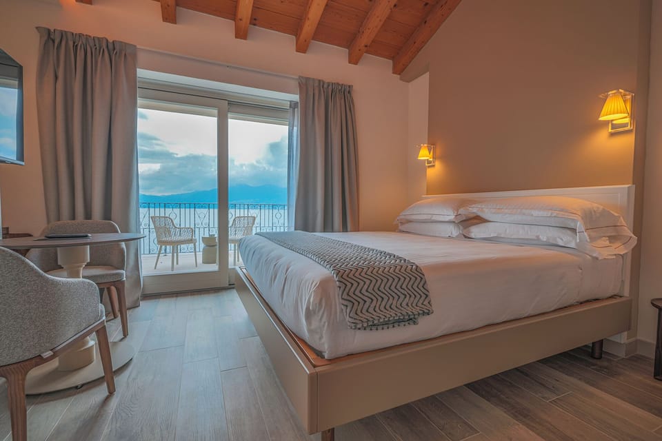 Junior Suite, Terrace, Lake View | In-room safe, desk, laptop workspace, blackout drapes