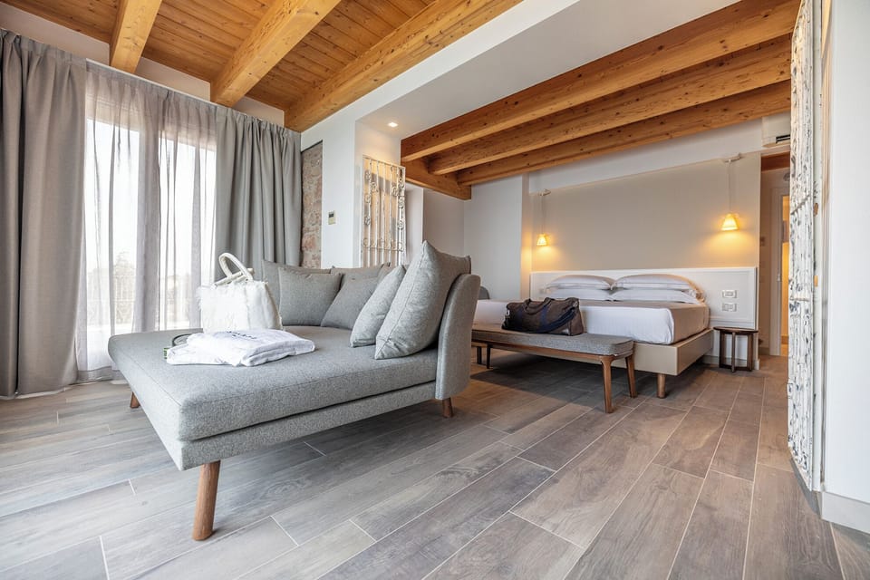 Junior Suite, Terrace, Lake View (Deluxe) | In-room safe, desk, laptop workspace, blackout drapes