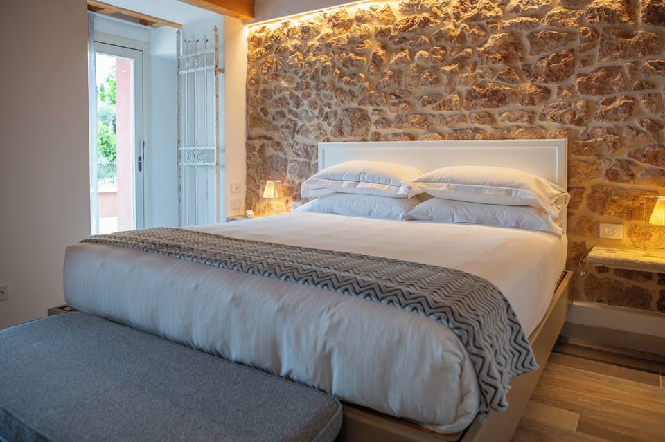 Junior Suite, Terrace, Lake View | In-room safe, desk, laptop workspace, blackout drapes