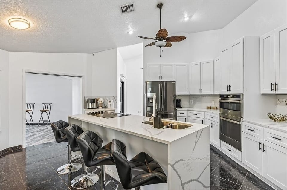 Indoors, Chair, Furniture, Cooktop, Kitchen