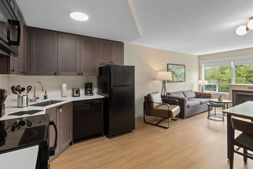 Condo, 2 Bedrooms | Shared kitchen | Full-size fridge, microwave, stovetop, toaster