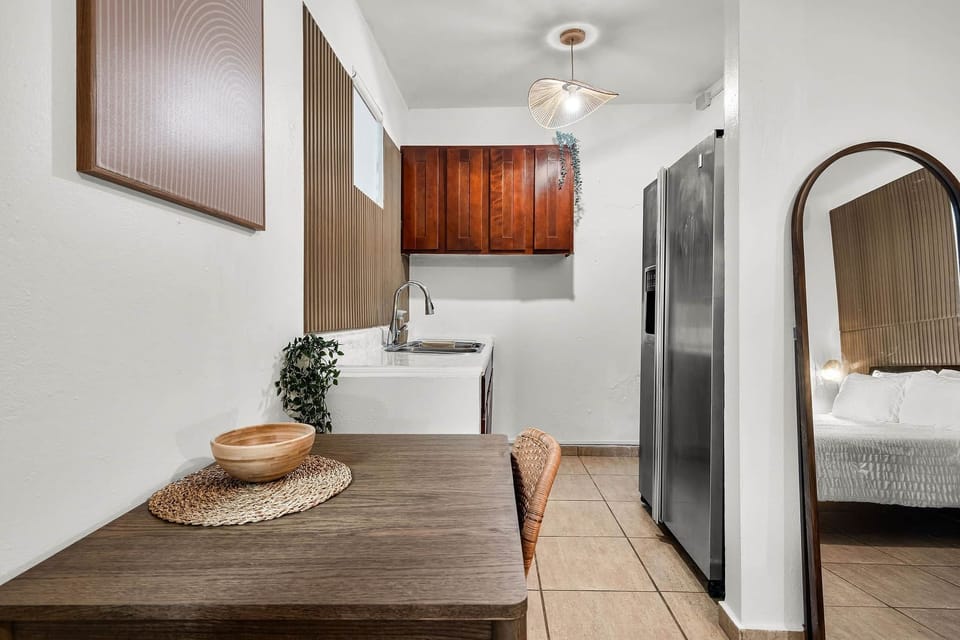 Kitchenette and dining nook with warm wood finishes