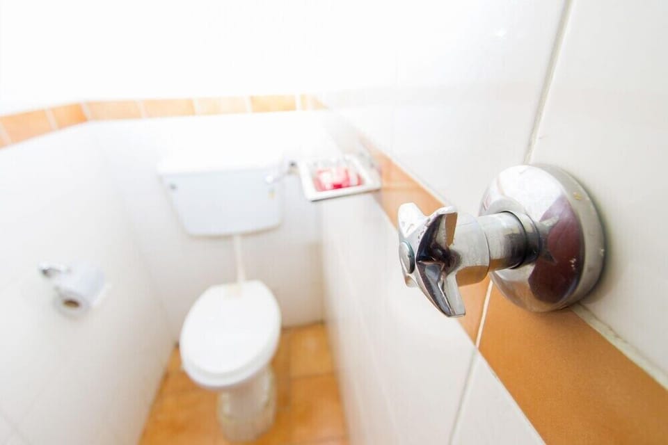 Shower, slippers, towels, soap