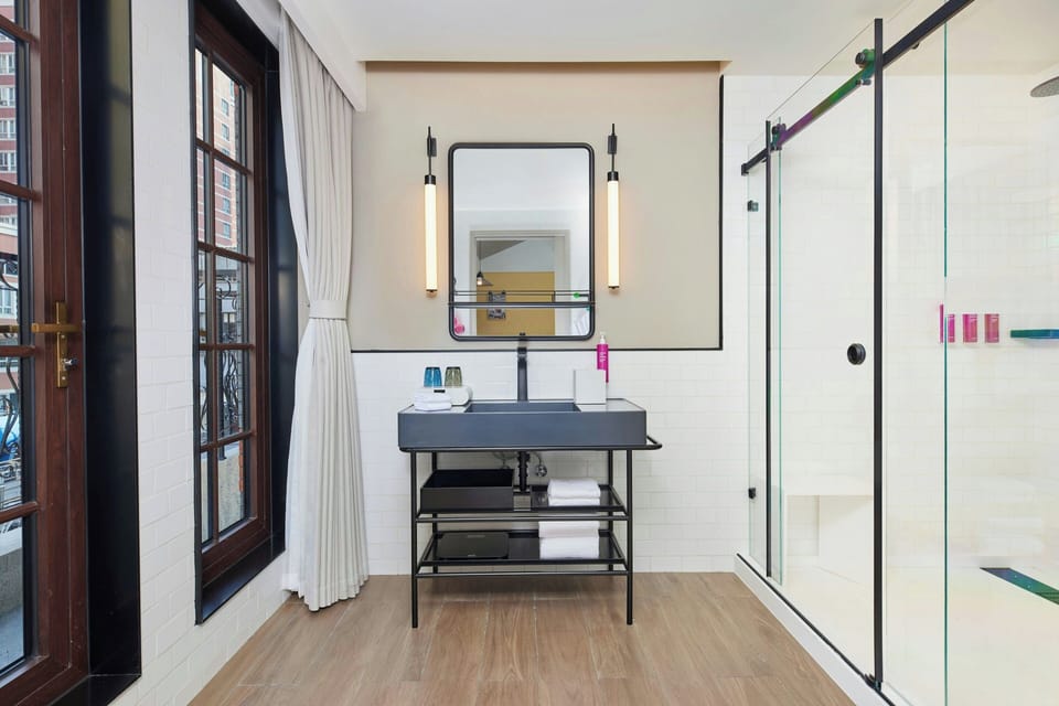 Room, 1 King Bed, Balcony, City View | Bathroom | Shower, hair dryer, slippers, towels