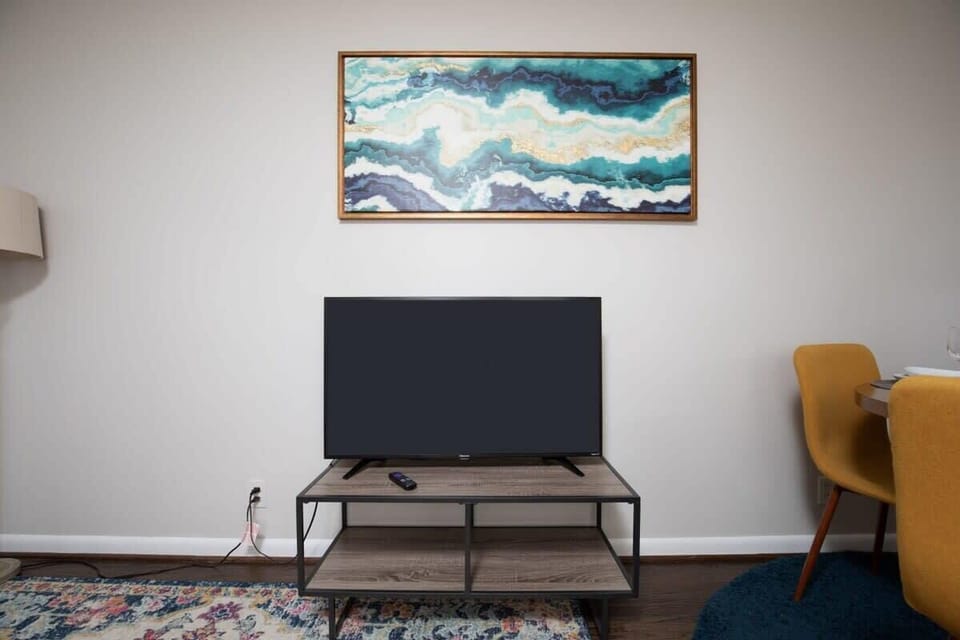 Large flat screen TV complete with Roku.