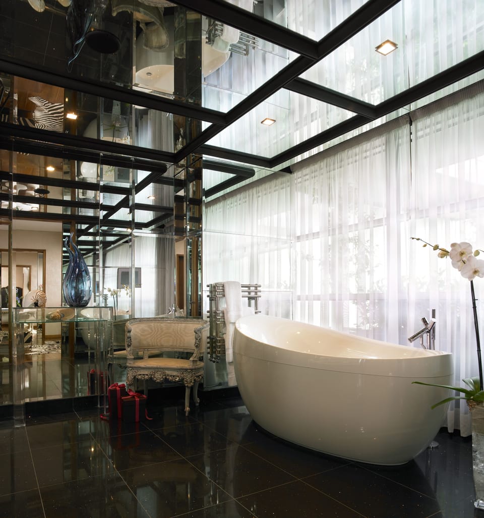 Combined shower/tub, bathrobes, slippers, towels