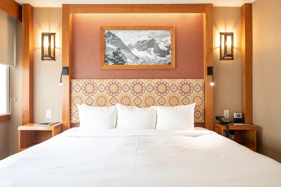 Get a sumptuous night sleep on the plush king-sized bed in this beautiful mountain room.