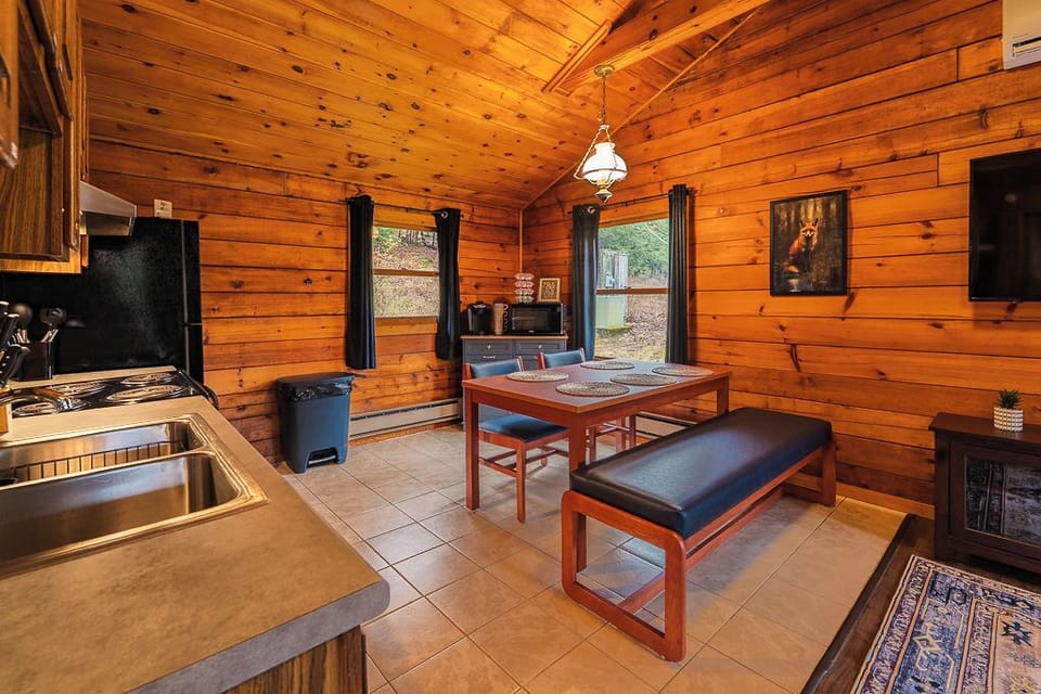 Open-concept kitchen and dining area with full appliances and seating for up to six—perfect for meals or game night.