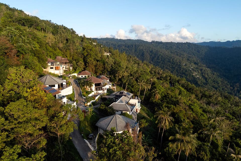 Villa sunrise and neighboring villas in a peaceful, green hillside retreat.