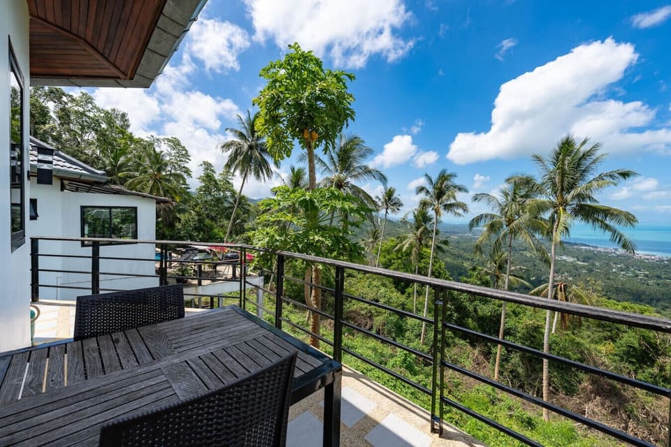 Private balcony with tropical garden and ocean view from Koh Samui seaview bungalow