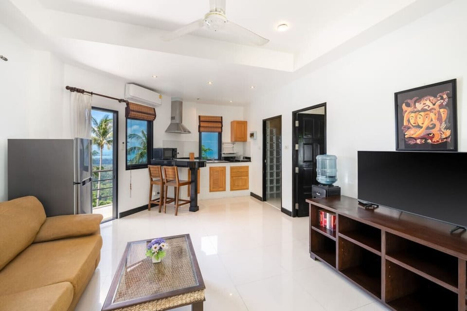Elevated terrace with ocean view and tropical surroundings at Koh Samui seaview bungalow