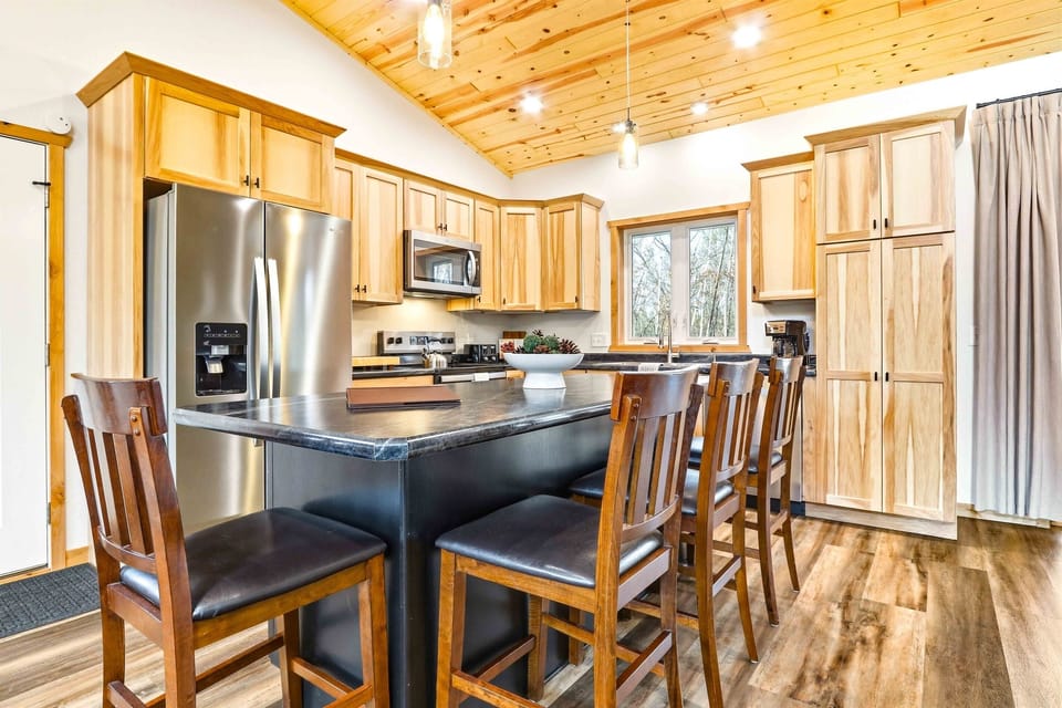 Your bar seating for four at the island means breakfast never has to wait for a table. The kitchen stays open to the living area so nobody misses a conversation.
