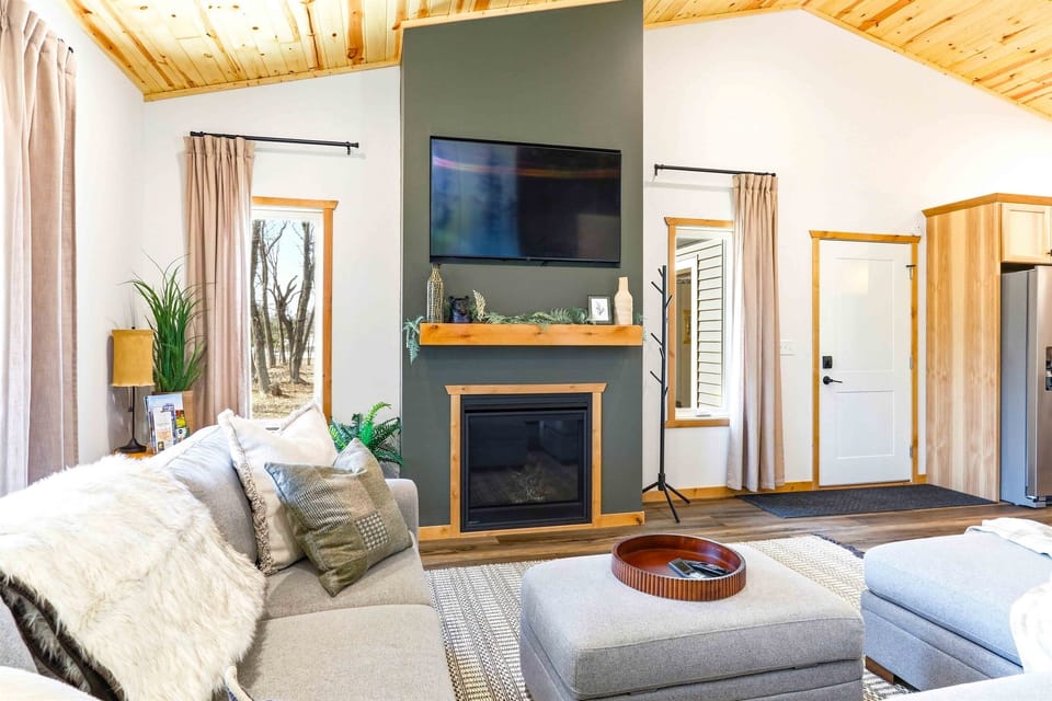 Open plan means the cook stays in the conversation. Living room, kitchen, and dining all visible from one spot — the group never splits when the space flows this well.